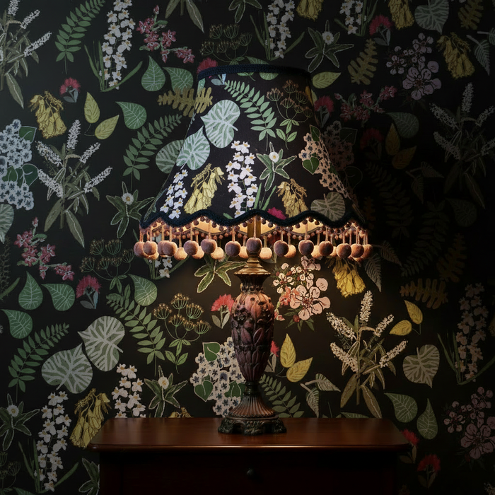 Lampshade with Abel Tasman pattern matching the black mural background