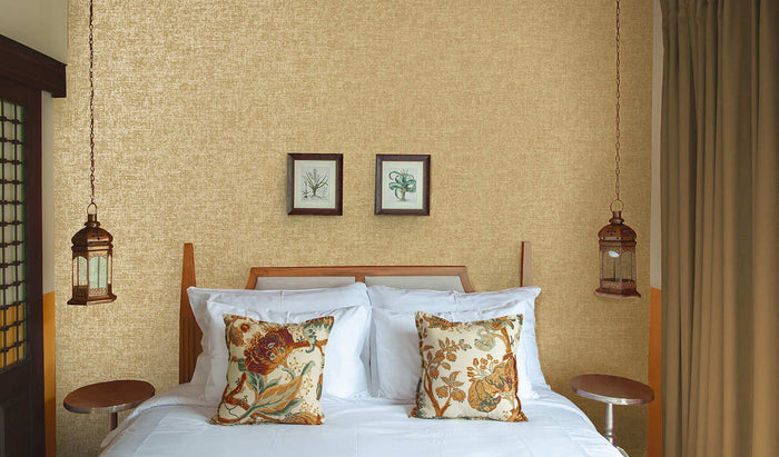 Ajanta wallpaper in Gold hung on a feature wall