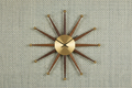 Product shot with mid-century clock and Sage Blue Metallic Turquoise grasscloth