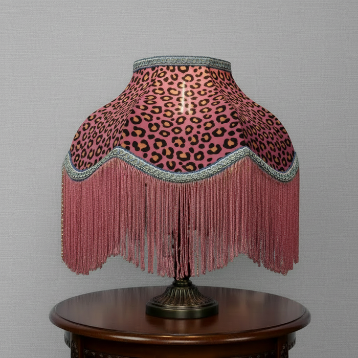 Animal print lampshade with blue trim and gold-beaded tassels