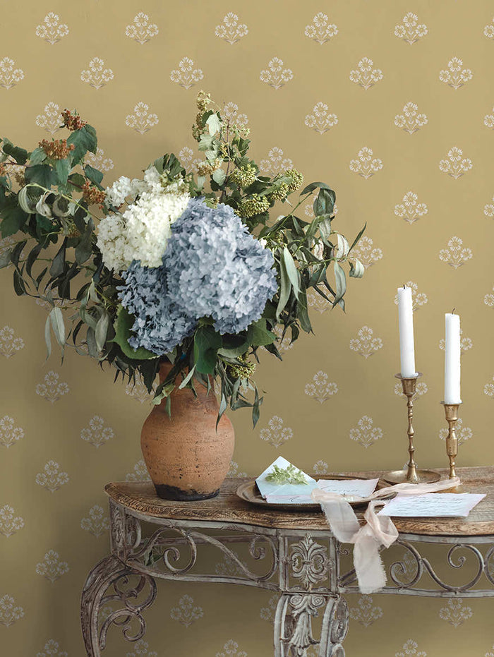 Ochre Isadora floral sprig wallpaper on a hallway wall