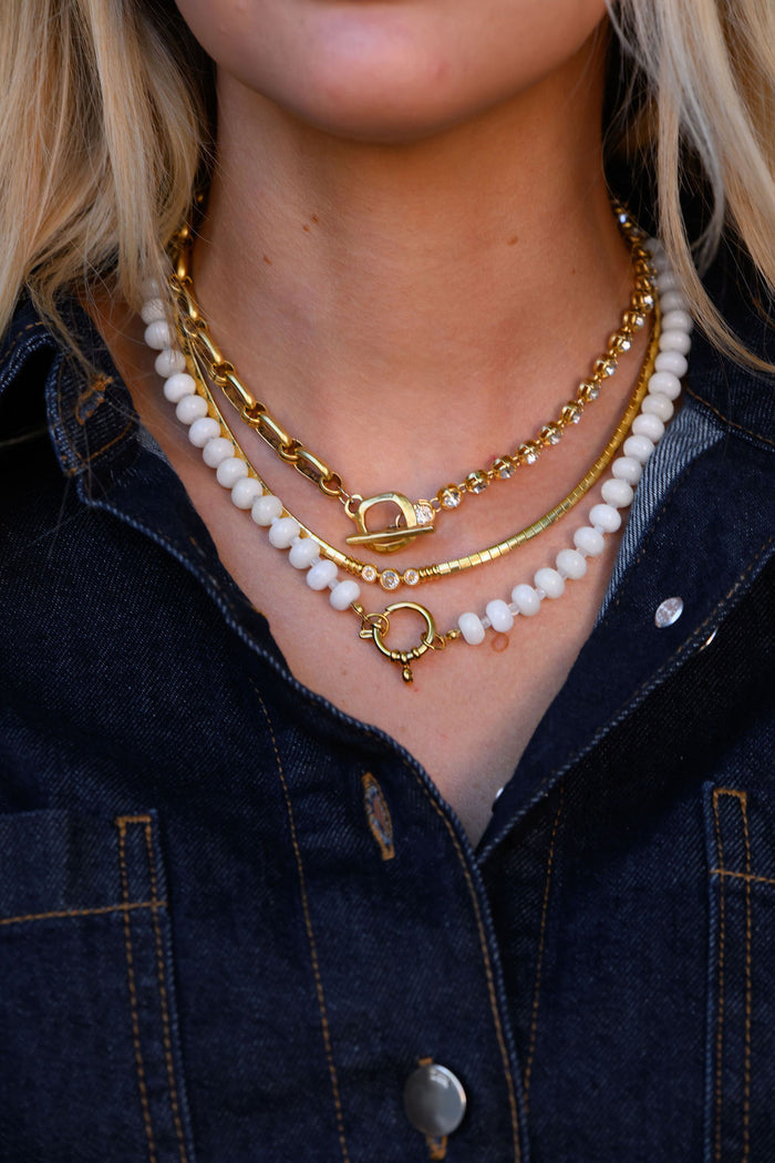 The Loretta necklace, bold gold links set with sparkling cubic zirconia crystals