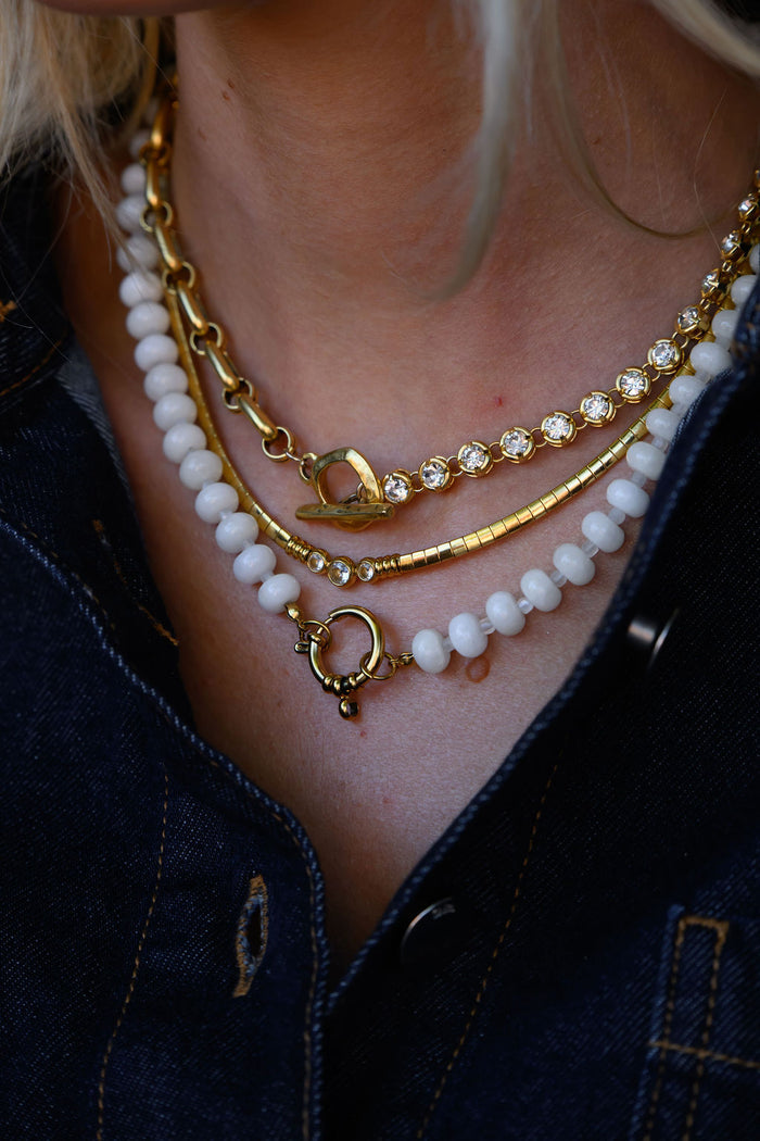 Loretta necklace in gold with crystal accents and a functional toggle clasp
