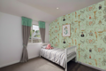 Bedroom with Pink Octopus and Grey Striped Bedspread