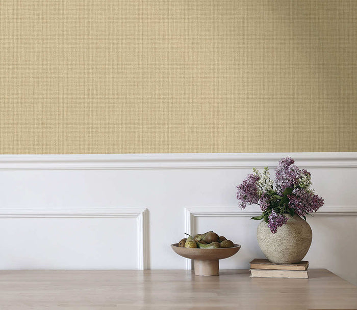 Warm sand Ormsby linen texture wallpaper on a living room wall