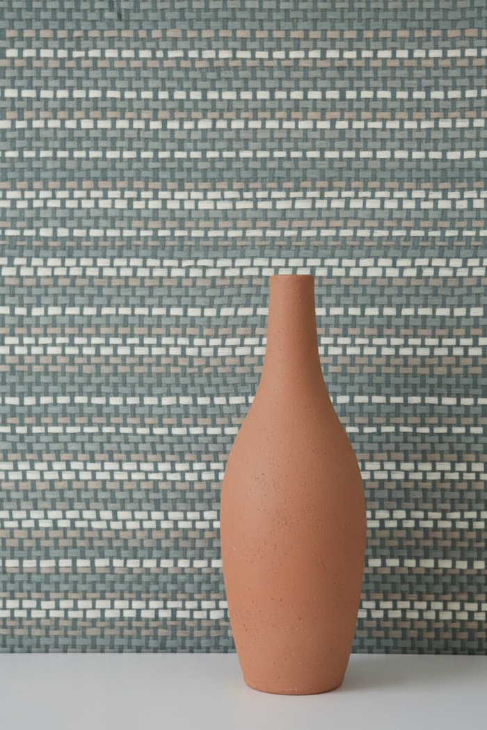 Tall artisanal clay vase against correct W611-33 Sage Blue grasscloth