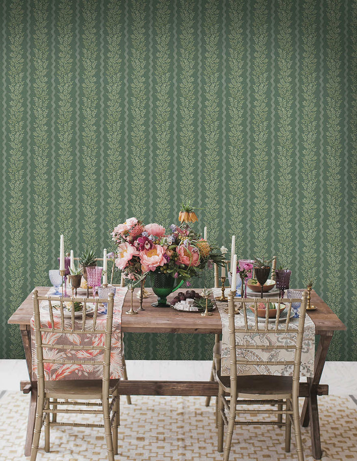 Green Pipkin leaf stripe wallpaper on a bathroom wall