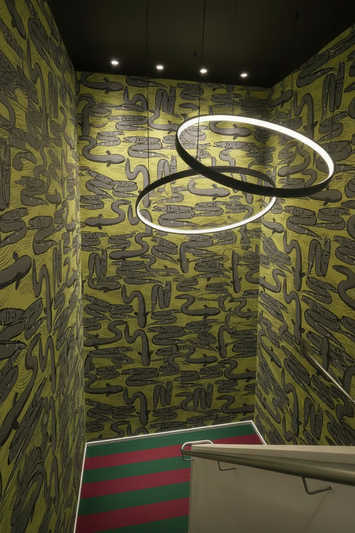 Stairwell with red and green striped carpet