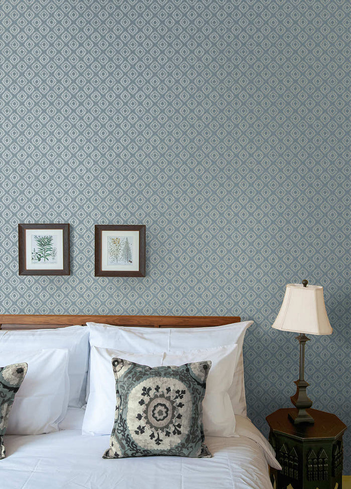 Sunstone wallpaper in Blue hung on a feature wall