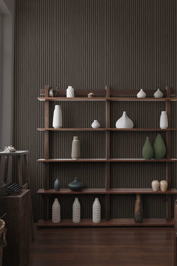 Teak wallpaper in Charcoal hung on a feature wall